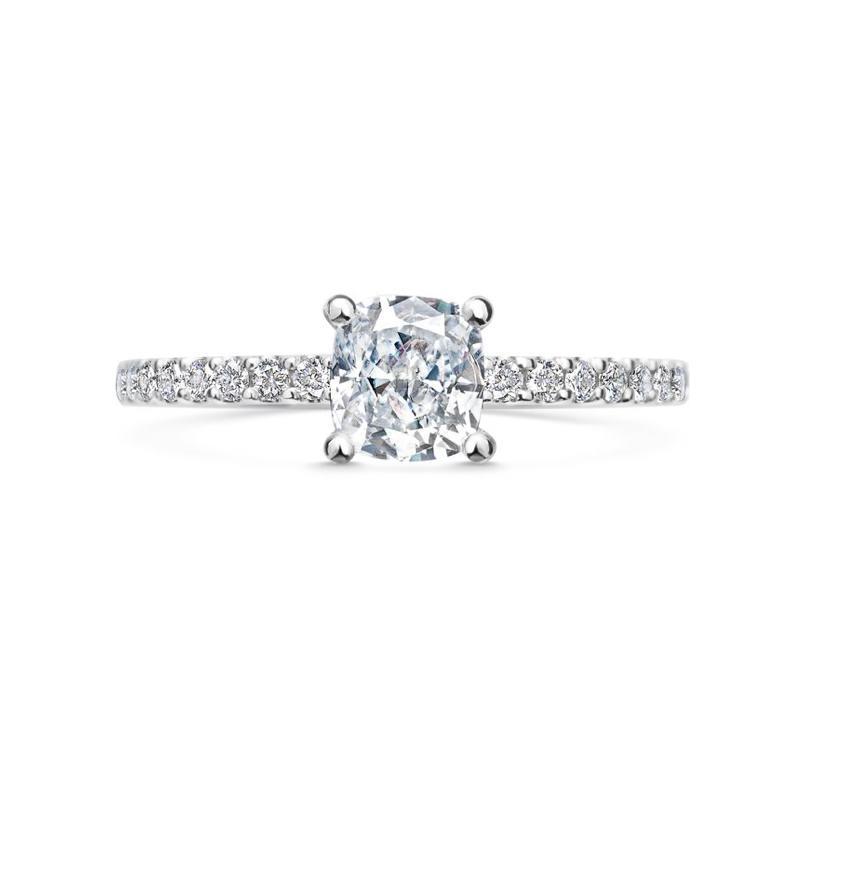Round solitaire ring with pave band